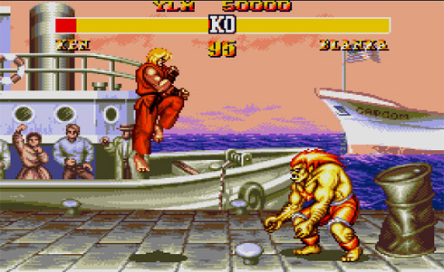 Captura del juego Street Fighter, que representa el combate entre diseñador web vs operario de photoshop